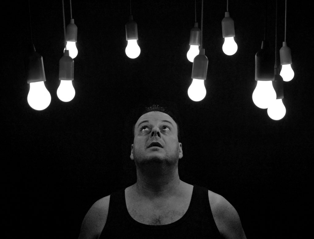 man looking at lights